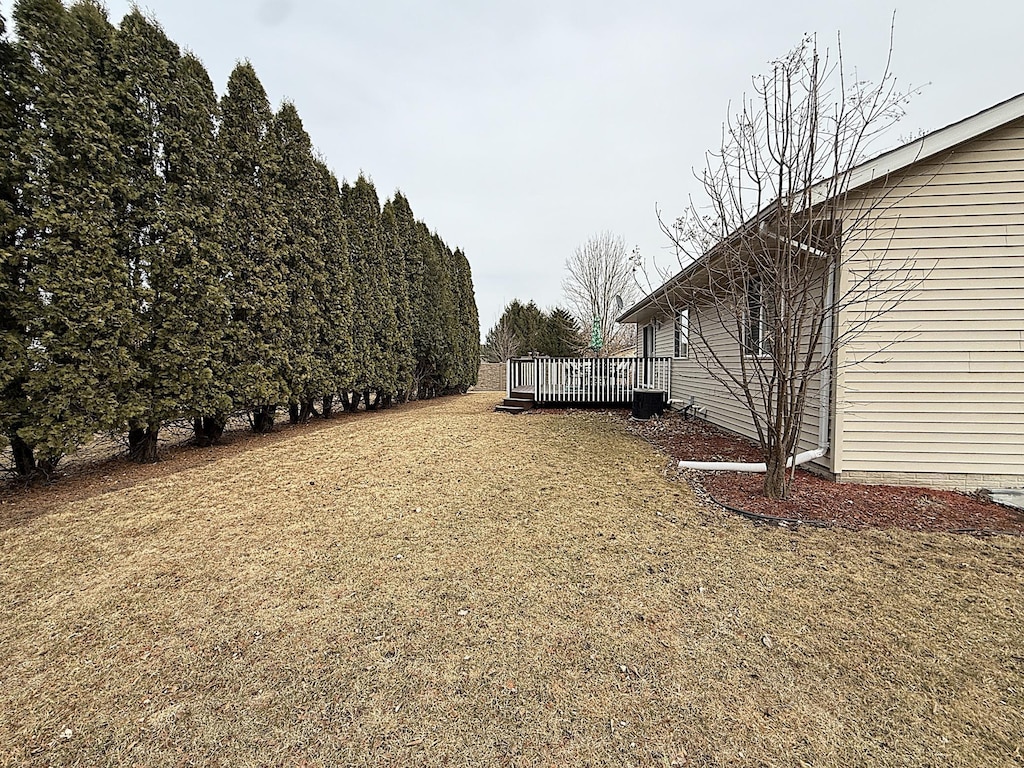 view of yard featuring a wooden deck