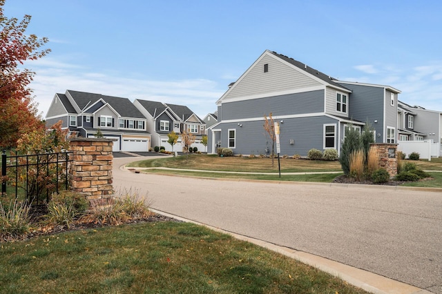 view of road with a residential view and curbs