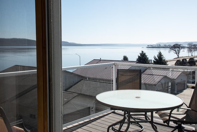 balcony featuring a water view