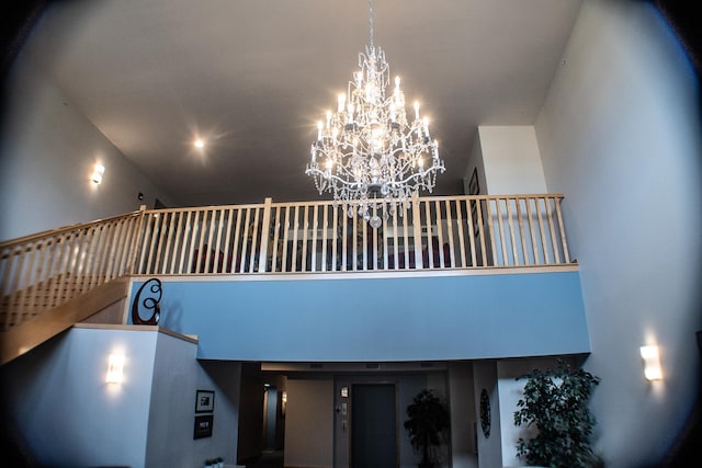 interior details featuring a chandelier
