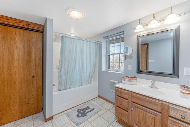 full bathroom featuring visible vents, shower / bath combo with shower curtain, baseboards, and vanity