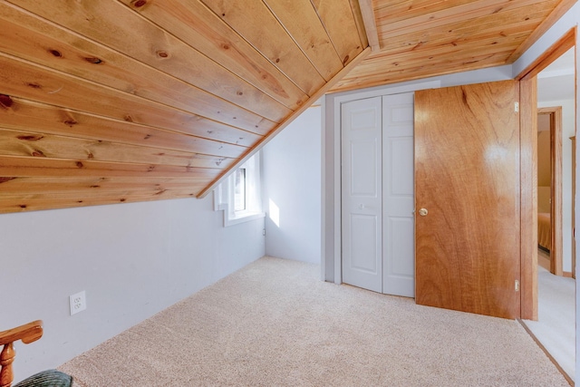 additional living space featuring lofted ceiling, wood ceiling, and carpet flooring