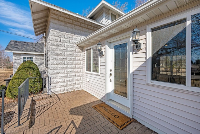 property entrance with a patio