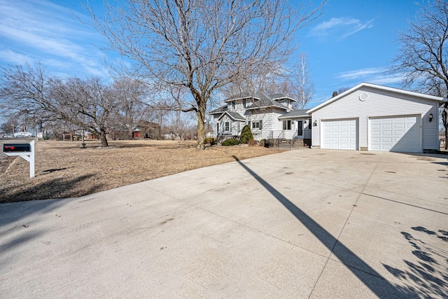 exterior space featuring a garage and concrete driveway