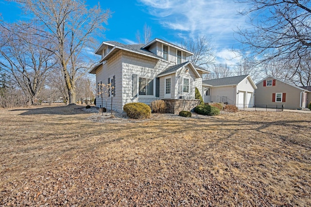 view of front of property with an outbuilding and a garage