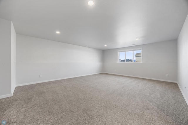 carpeted empty room with recessed lighting and baseboards