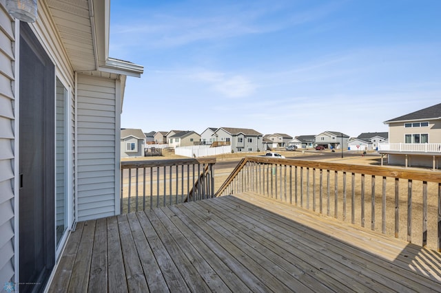 wooden deck with a residential view