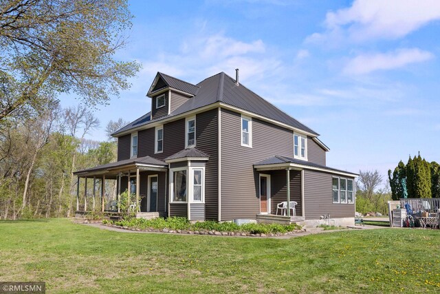 5664 County Road 7 SW, Howard Lake, MN 55349 - view of home's exterior with a yard, metal roof, and covered porch