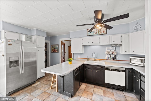 5664 County Road 7 SW, Howard Lake, MN 55349 - kitchen featuring a sink, ceiling fan, white cabinetry, light countertops, and appliances with stainless steel finishes