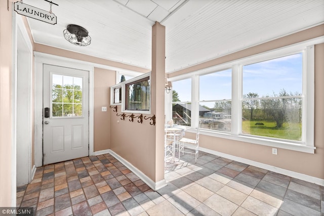 5664 County Road 7 SW, Howard Lake, MN 55349 - foyer entrance featuring baseboards and stone tile flooring