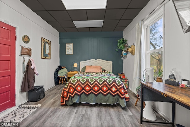 5664 County Road 7 SW, Howard Lake, MN 55349 - bedroom featuring a paneled ceiling and wood finished floors
