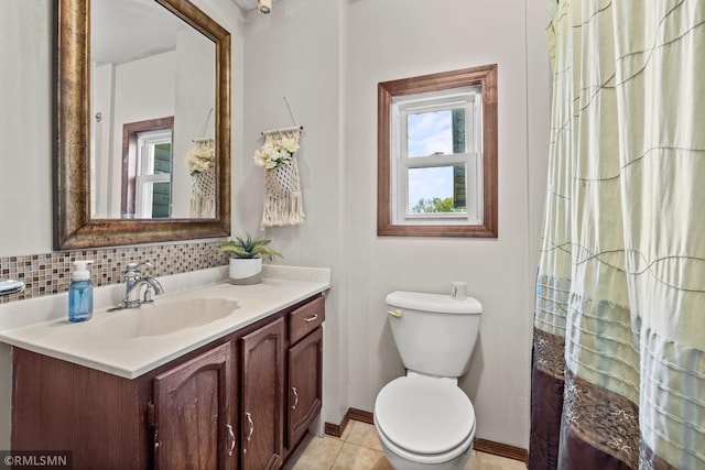 5664 County Road 7 SW, Howard Lake, MN 55349 - full bathroom featuring vanity, toilet, baseboards, and tile patterned floors