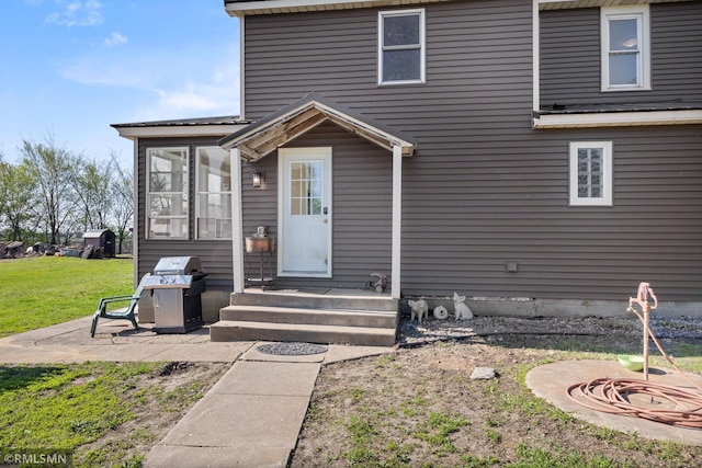 5664 County Road 7 SW, Howard Lake, MN 55349 - view of front of house featuring a sunroom, a patio, and a front yard