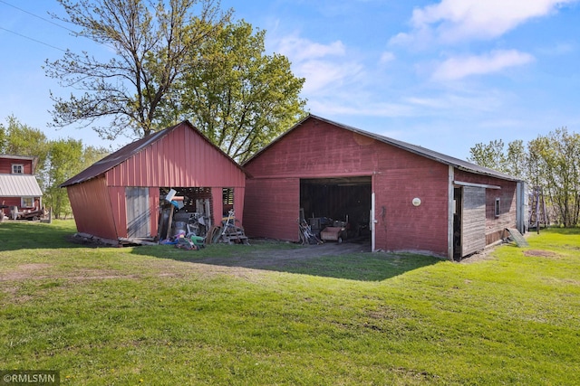 5664 County Road 7 SW, Howard Lake, MN 55349 - view of pole building featuring a lawn