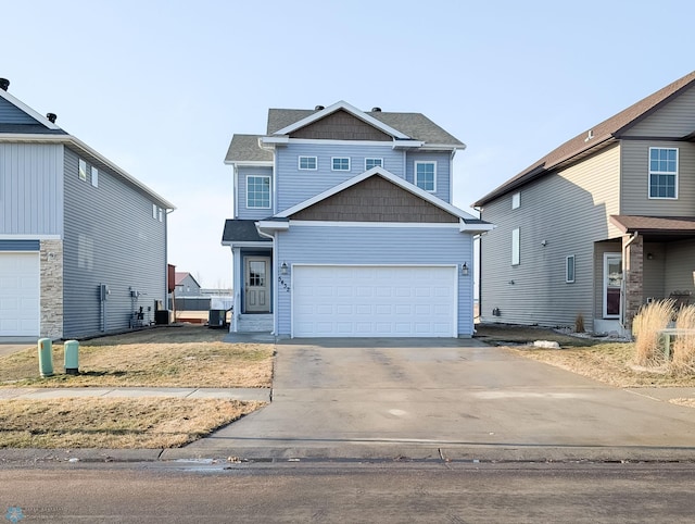 view of front facade featuring concrete driveway and a garage