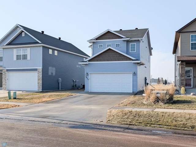 view of front facade with stone siding, concrete driveway, and a garage