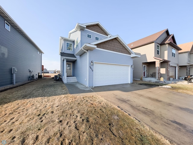 view of front of house featuring concrete driveway and an attached garage