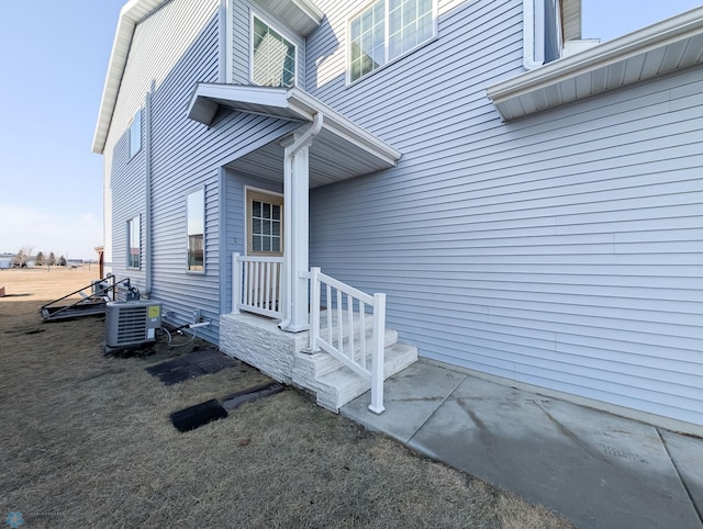 entrance to property featuring central AC