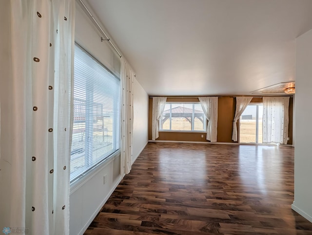 empty room featuring dark wood-style floors