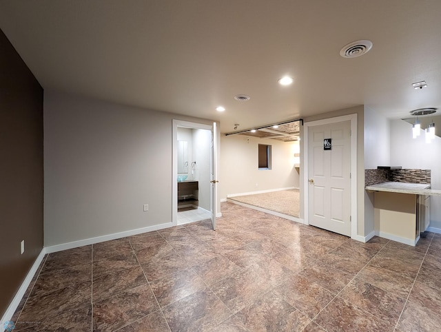 interior space with visible vents, recessed lighting, and baseboards