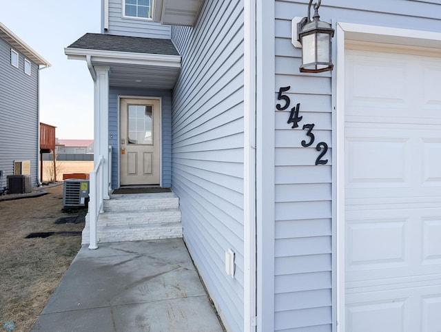 doorway to property featuring central AC