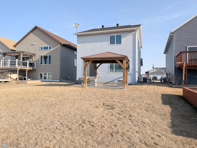 rear view of house with a gazebo and a pergola