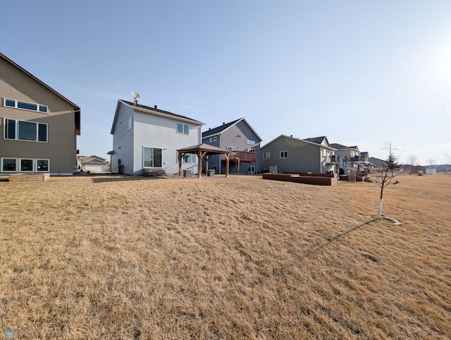 view of yard with a gazebo and a residential view