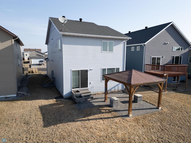 back of house featuring a gazebo, a patio area, and entry steps