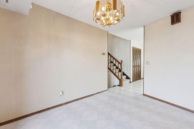 unfurnished room featuring stairway, baseboards, and a chandelier