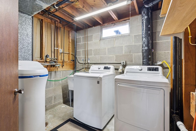 clothes washing area with laundry area and separate washer and dryer