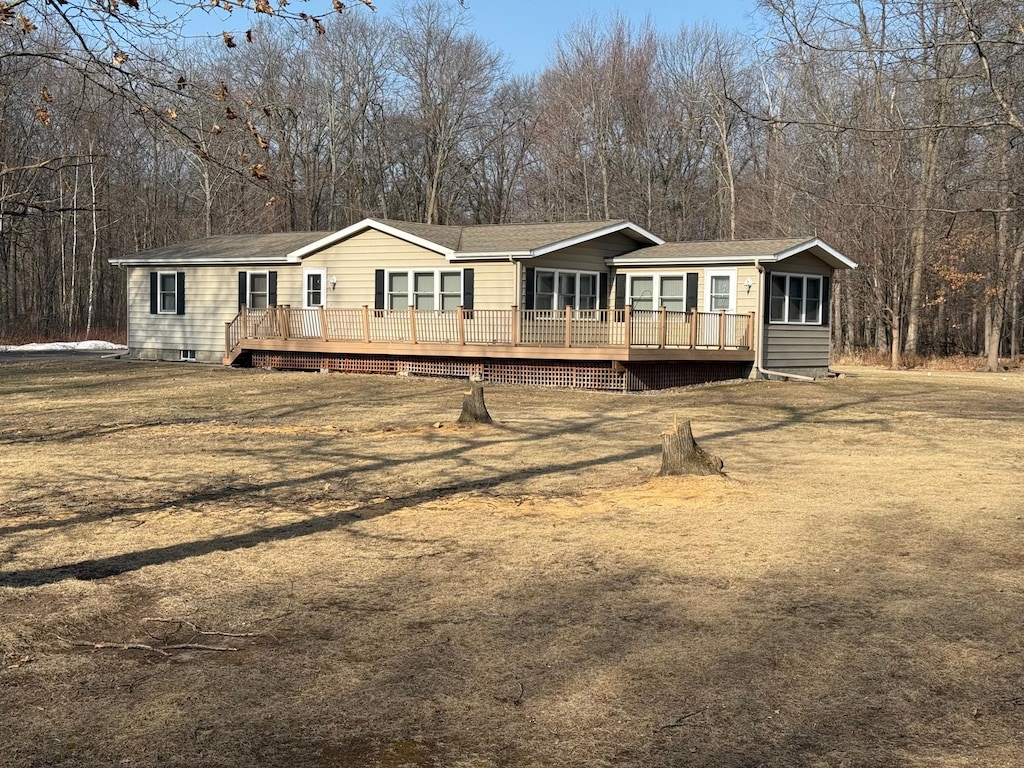 manufactured / mobile home featuring crawl space and a deck