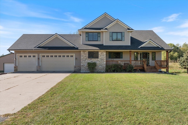 view of front of home with a front yard, an attached garage, covered porch, a shingled roof, and concrete driveway