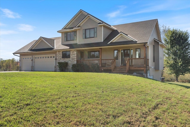 view of front of property featuring a front lawn, stone siding, roof with shingles, covered porch, and a garage