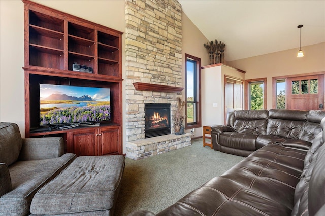 living area featuring high vaulted ceiling, a stone fireplace, and carpet flooring