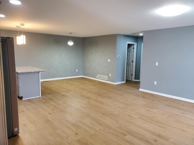 spare room featuring recessed lighting, visible vents, baseboards, and light wood finished floors