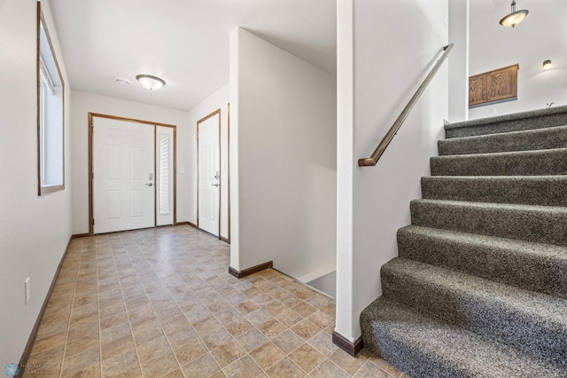 6098 55th Ave S, Fargo, ND 58104 - entrance foyer with stairway and baseboards