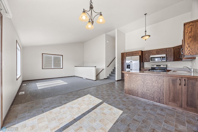 6098 55th Ave S, Fargo, ND 58104 - kitchen featuring a sink, appliances with stainless steel finishes, open floor plan, and hanging light fixtures