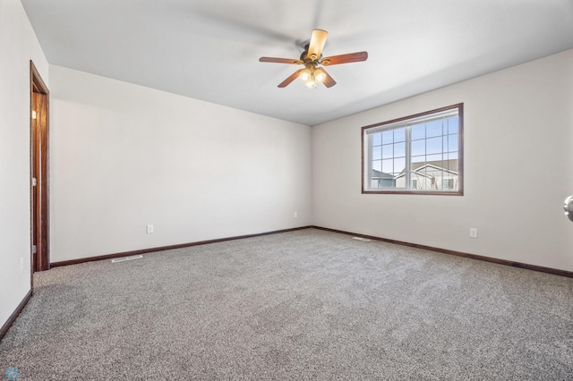 6098 55th Ave S, Fargo, ND 58104 - carpeted spare room featuring visible vents, baseboards, and a ceiling fan