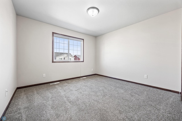 6098 55th Ave S, Fargo, ND 58104 - carpeted spare room with visible vents and baseboards