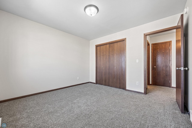 6098 55th Ave S, Fargo, ND 58104 - unfurnished bedroom with a closet, baseboards, and carpet