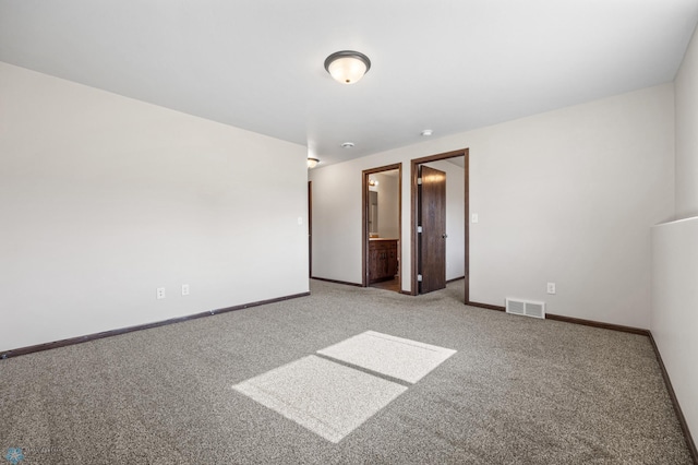6098 55th Ave S, Fargo, ND 58104 - empty room with visible vents, baseboards, and carpet