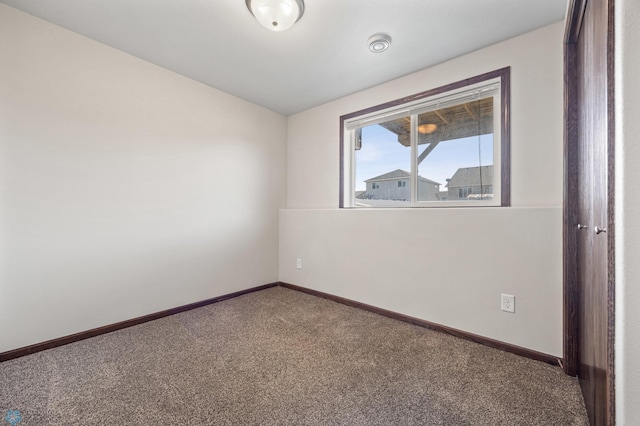 6098 55th Ave S, Fargo, ND 58104 - empty room featuring baseboards and carpet floors