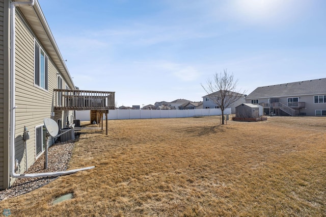 6098 55th Ave S, Fargo, ND 58104 - view of yard with a deck, an outbuilding, fence, and a shed