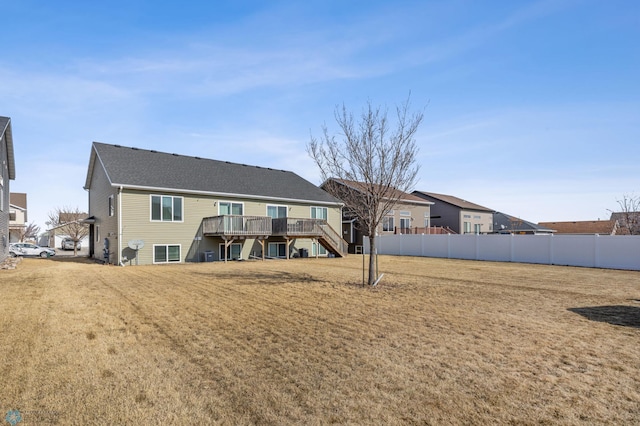 6098 55th Ave S, Fargo, ND 58104 - back of house featuring a wooden deck, stairs, a yard, and fence