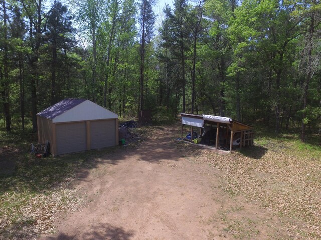 30349 Johnson Creek Trl, Webb Lake, WI 54830 - view of outdoor structure featuring a forest view