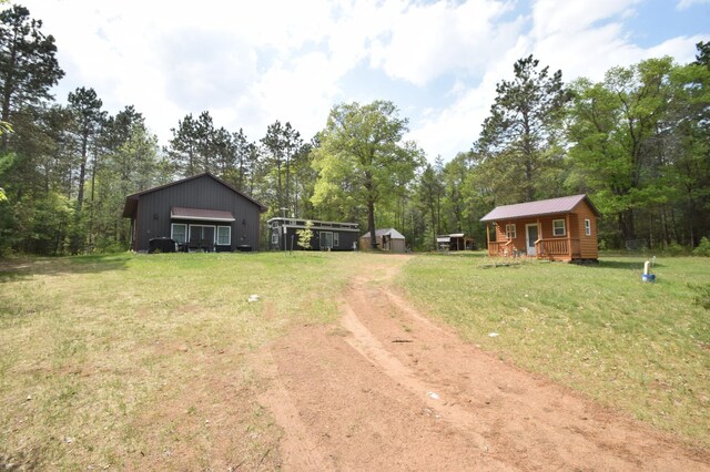 30349 Johnson Creek Trl, Webb Lake, WI 54830 - view of dirt / gravel road featuring view of scattered trees