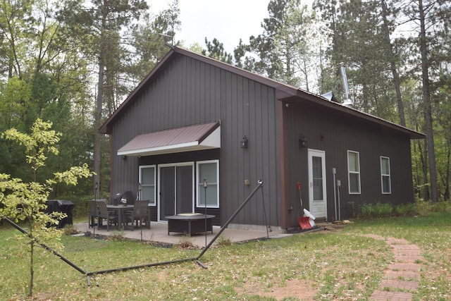 30349 Johnson Creek Trl, Webb Lake, WI 54830 - rear view of house with a patio area and a lawn