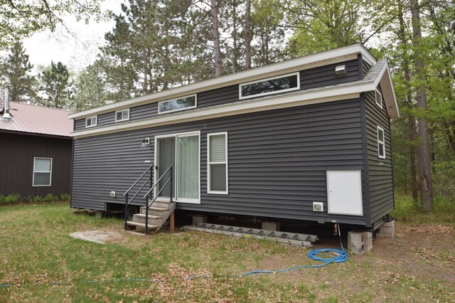 30349 Johnson Creek Trl, Webb Lake, WI 54830 - back of house featuring entry steps and a yard