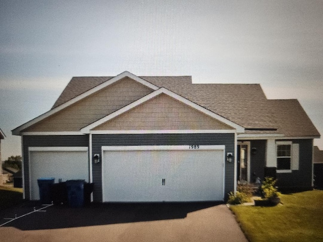 view of front of property with an attached garage and driveway