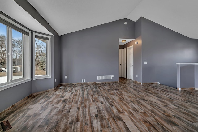 interior space featuring visible vents, lofted ceiling, and wood finished floors